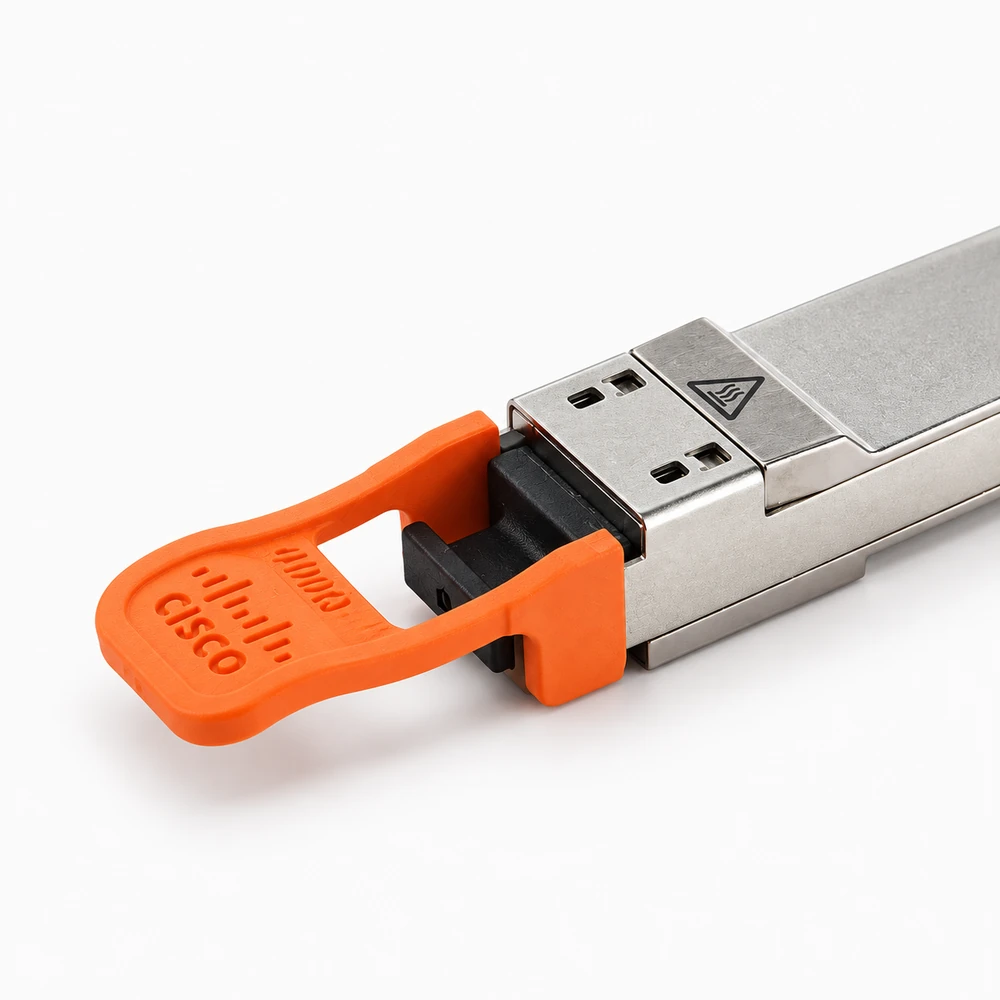 Close-up of a pluggable optical transceiver housing with orange pull tab